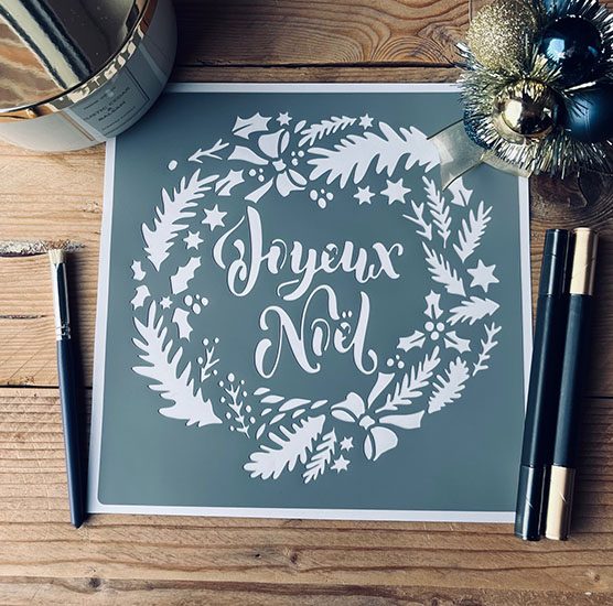 Pochoir Adhésif 20 x 20 cm Couronne Stylisée Joyeux Noel 