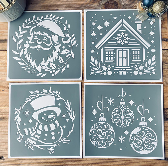 4 Pochoirs Adhésifs 20 x 20 cm PVC, Thème de Noël (Père Noël, Boules, Bonhomme de Neige & Chalet) 