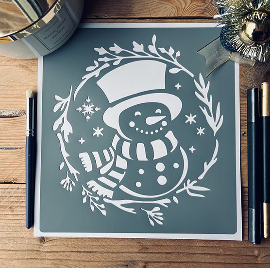 Pochoir Adhésif 20 x 20 cm Couronne de Noël & Bonhomme de Neige