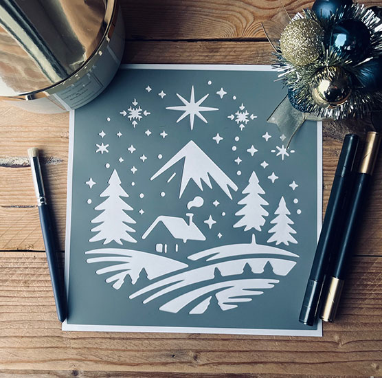 Pochoir Adhésif 20 x 20 cm Chalet de Noël & Montagnes